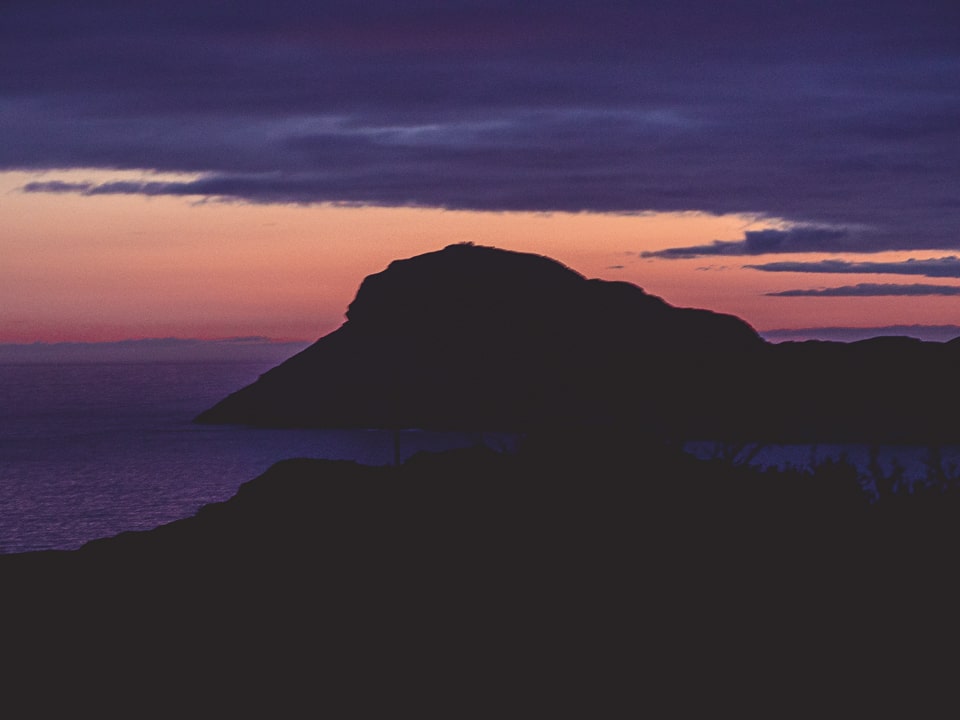 The sun sets over Brimstone Head, one of the corner of the Earth (according to Flat Earthers)